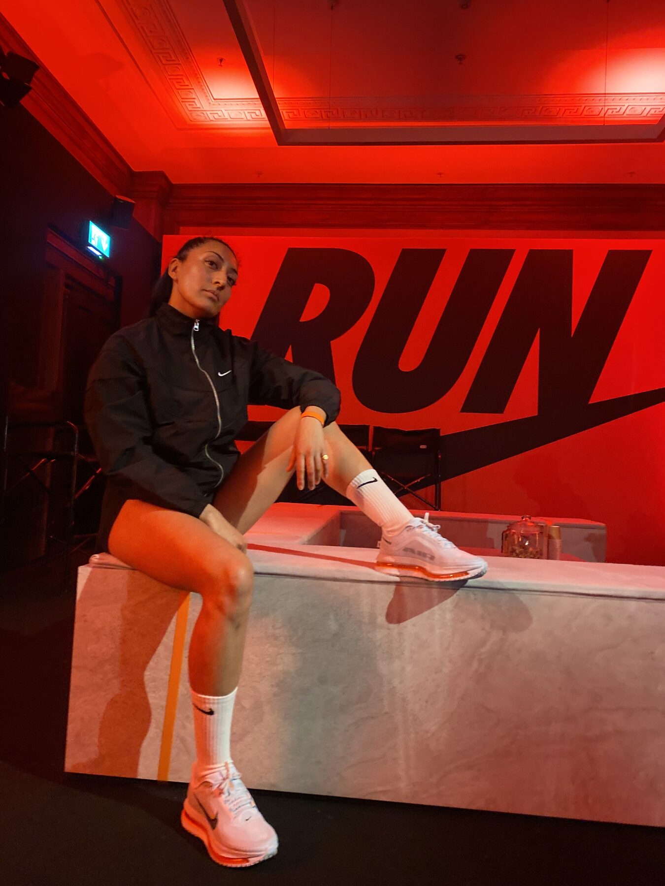 Vnisha in front of a Nike RUN backdrop